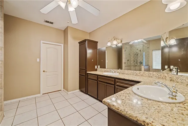 a kitchen with cabinets and stainless steel appliances