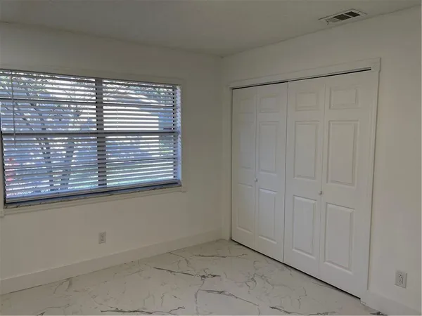 a view of a room that has a window in it
