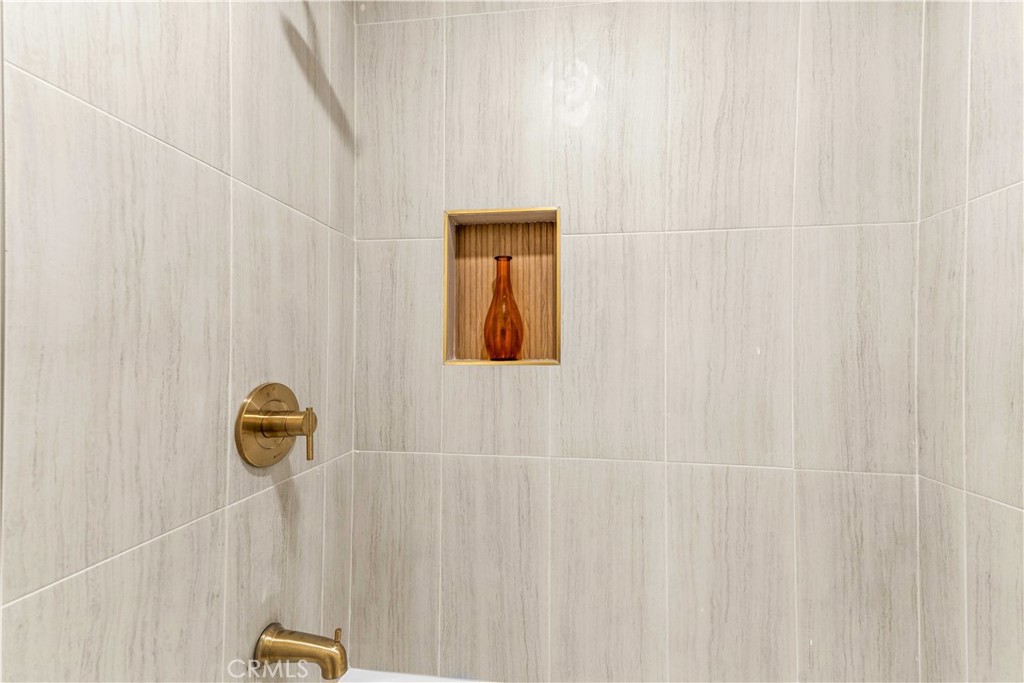 534 West 224th Place Carson, CA 90745 - Photo 14 of 35 a bathroom with a shower curtain and a window
