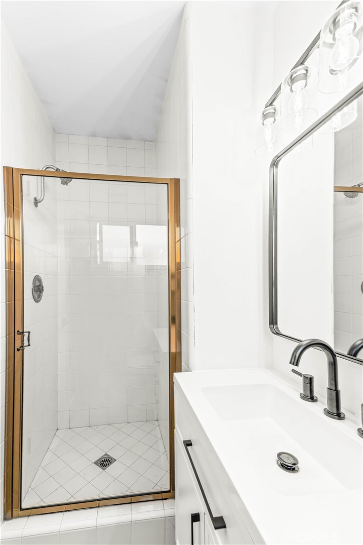 534 West 224th Place Carson, CA 90745 - Photo 25 of 35 a bathroom with a shower and a sink