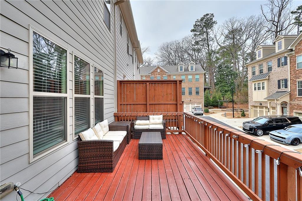 1306 Harris Way South Atlanta, GA 30319 - Photo 15 of 19 a view of balcony with couch and wooden floor