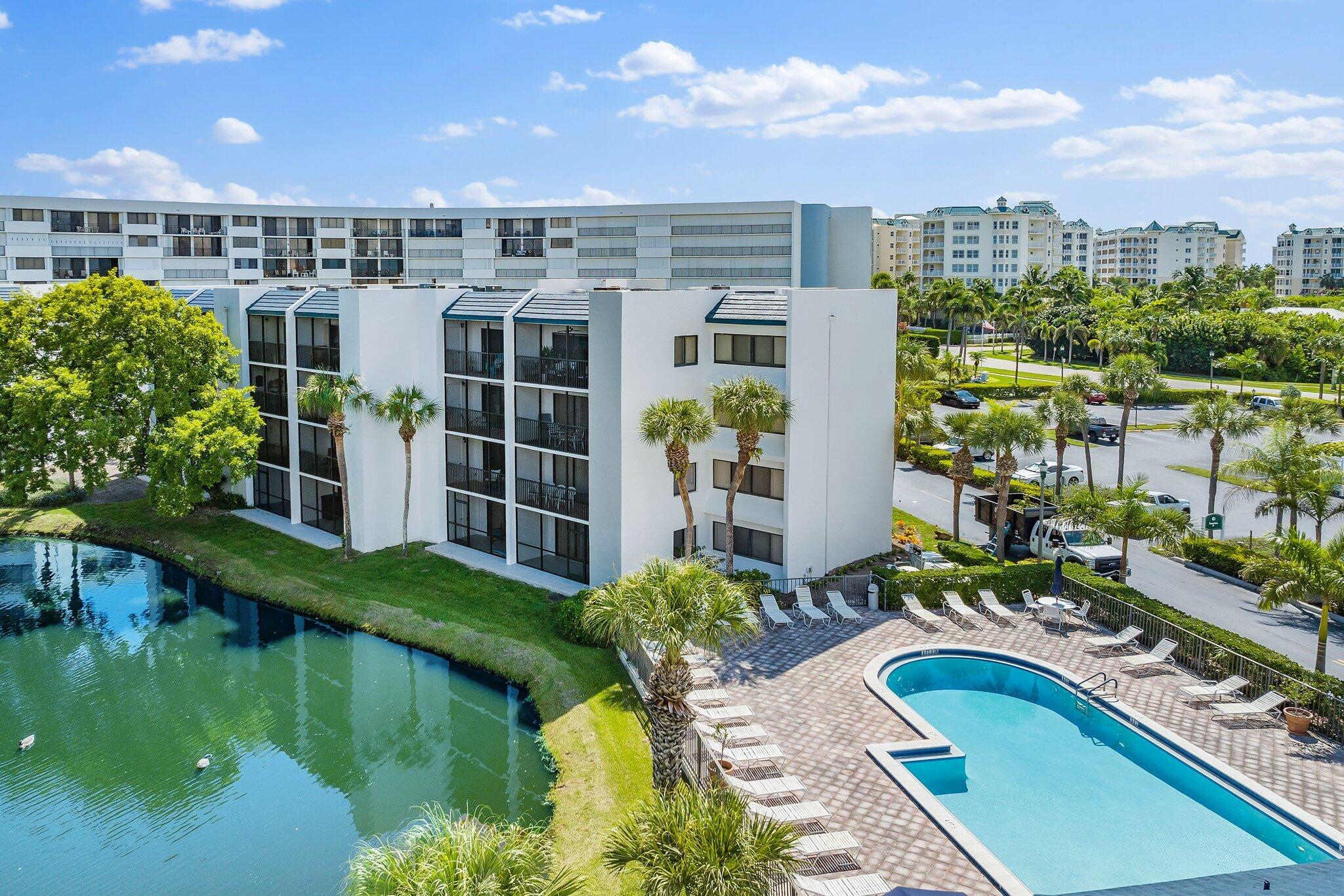 1605 Highway 1, Unit B104 Jupiter, FL 33477 - Photo 2 of 24 a view of a swimming pool and outdoor space