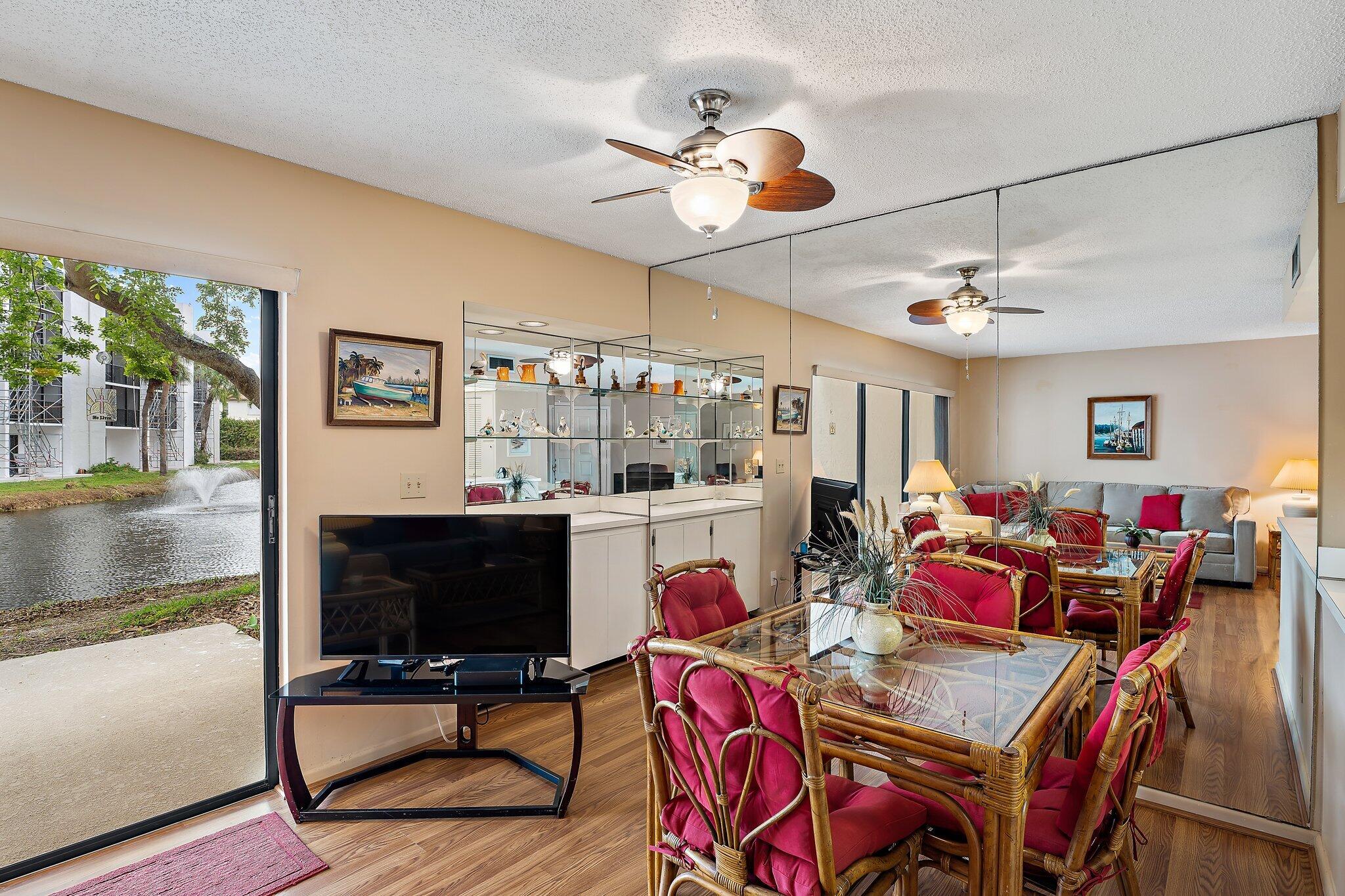 1605 Highway 1, Unit B104 Jupiter, FL 33477 - Photo 7 of 24 a view of a dining room with furniture window and outside view