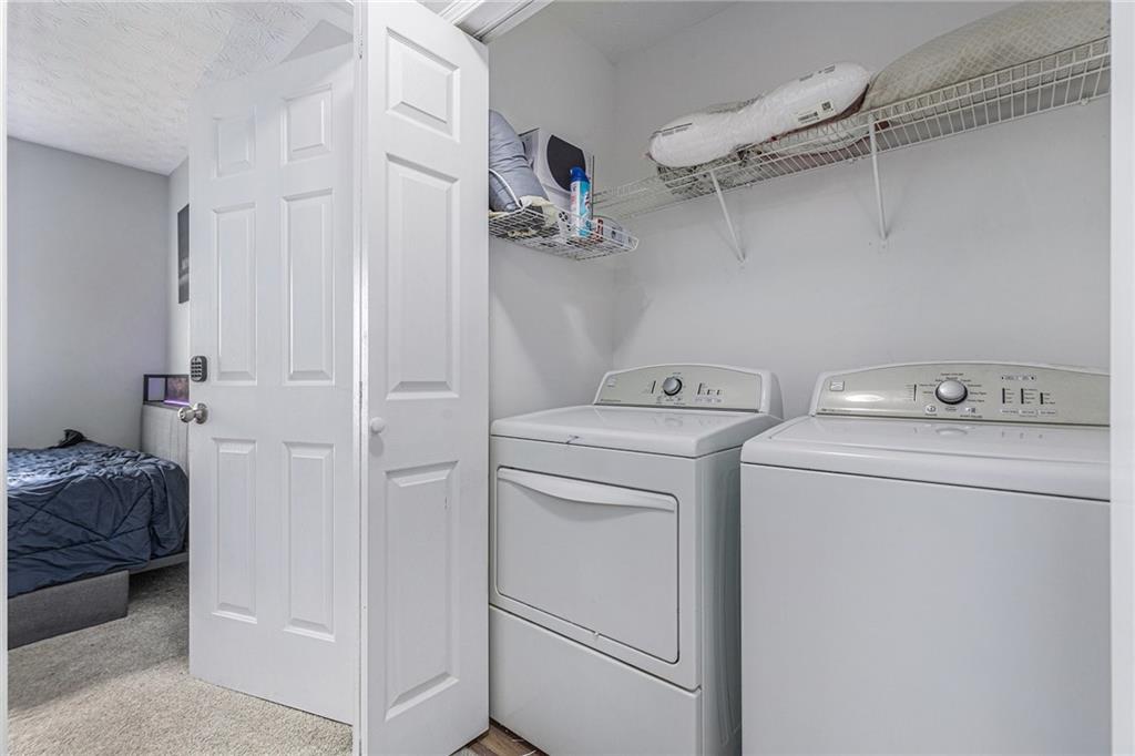 6536 Arbor Gate Drive Southwest, Unit 2 Mableton, GA 30126 - Photo 17 of 27 a utility room with dryer and washer