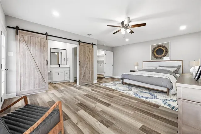 a bathroom with a shower toilet and sink