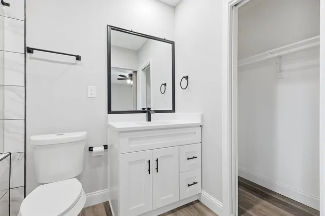 a view of room with window and ceiling fan