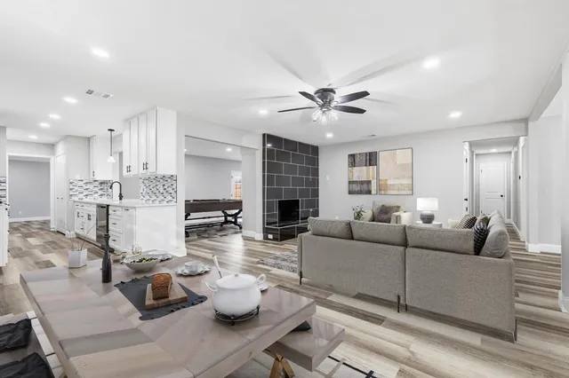 a living room with furniture and a fireplace