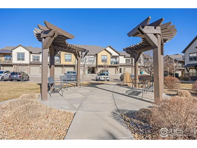 a view of a patio with a table and chairs