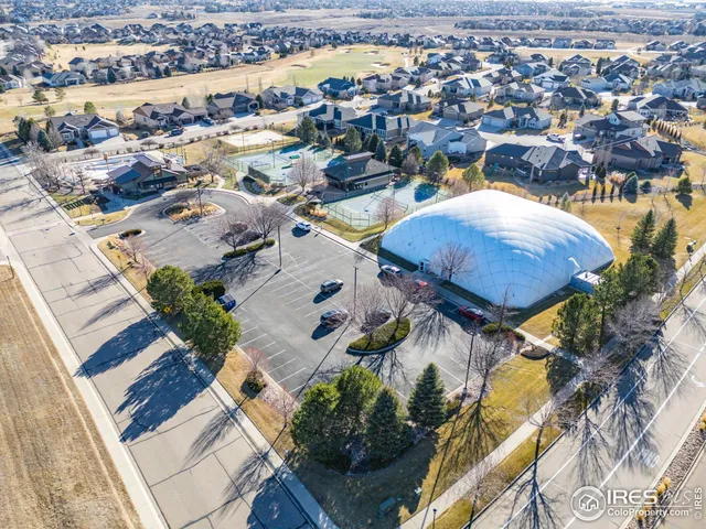 an aerial view of a house with outdoor space