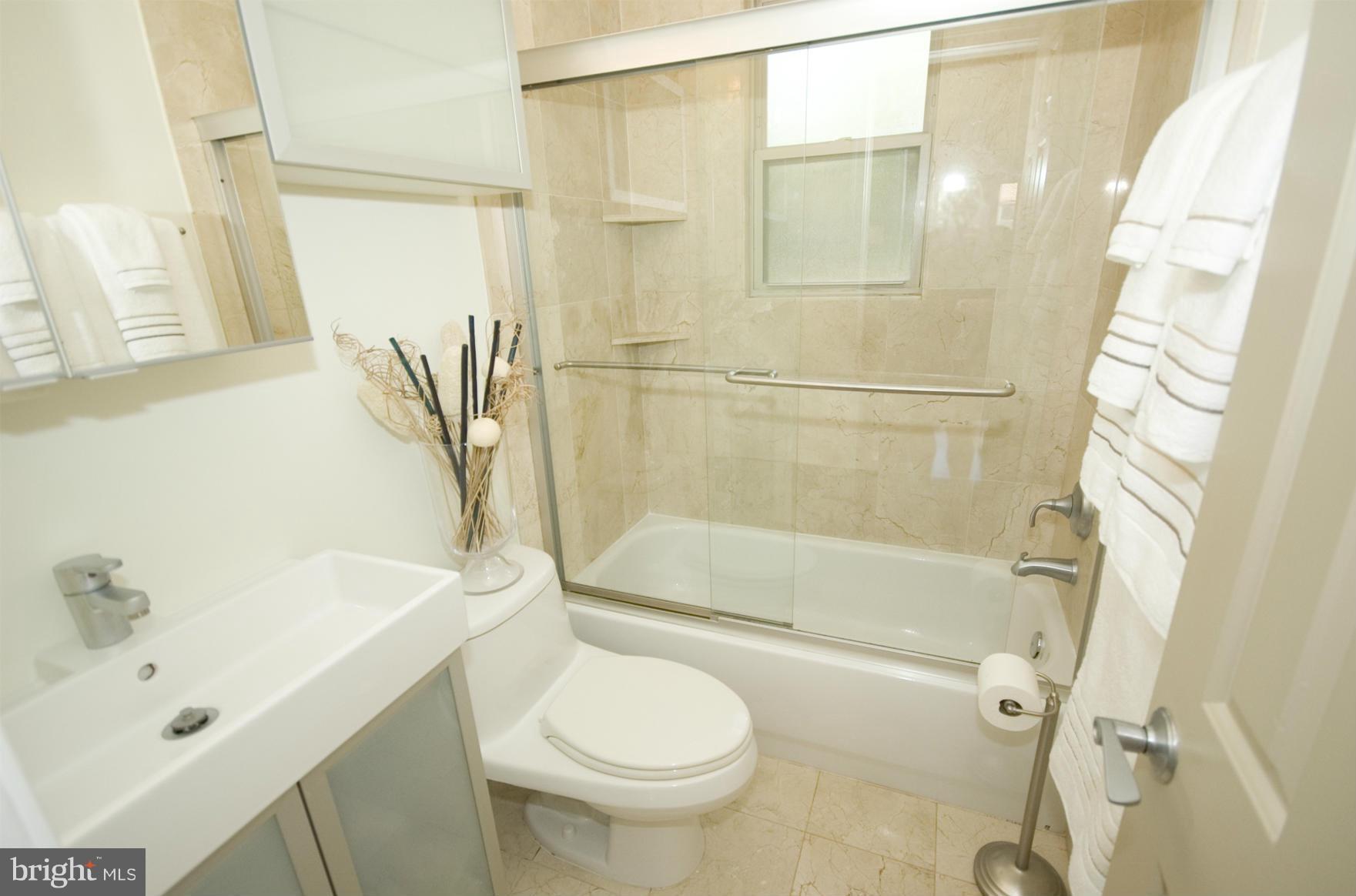 1363 K Street Southeast, Unit 103 Washington, DC 20003 - Photo 11 of 20 Marble bath with upgraded vanity
