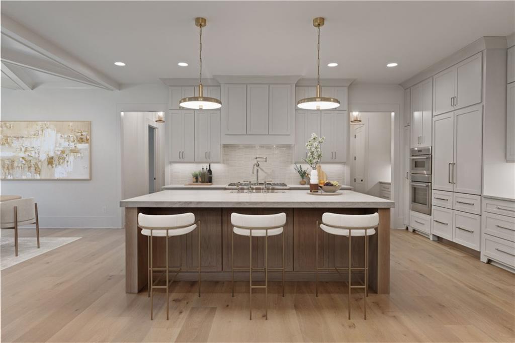 2701 Conns Creek Road, Unit 48 Ball Ground, GA 30107 - Photo 5 of 17 a dining table with chairs and wooden floor