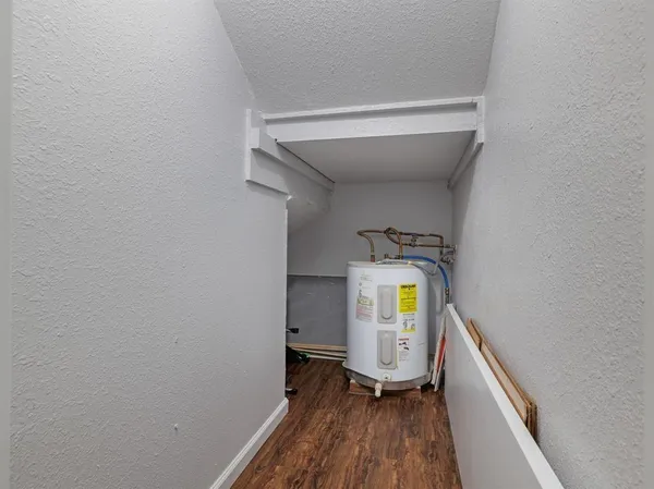 a view of an entryway with wooden floor