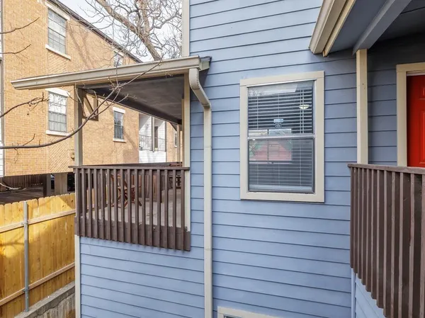 a view of a house with wooden deck