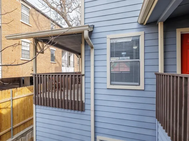 a view of a house with wooden deck