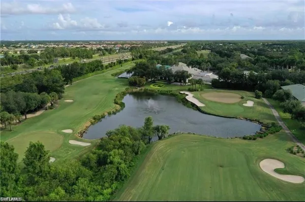 a view of a lake with a yard