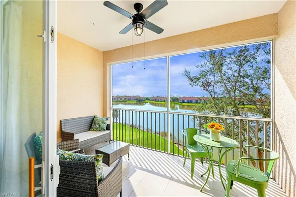 a view of a balcony with furniture