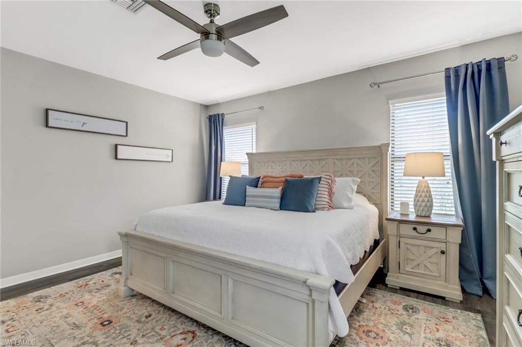 15354 Summit Pl Circle, Unit 159 Naples, FL 34119 - Photo 16 of 27 a bedroom with a bed and a window