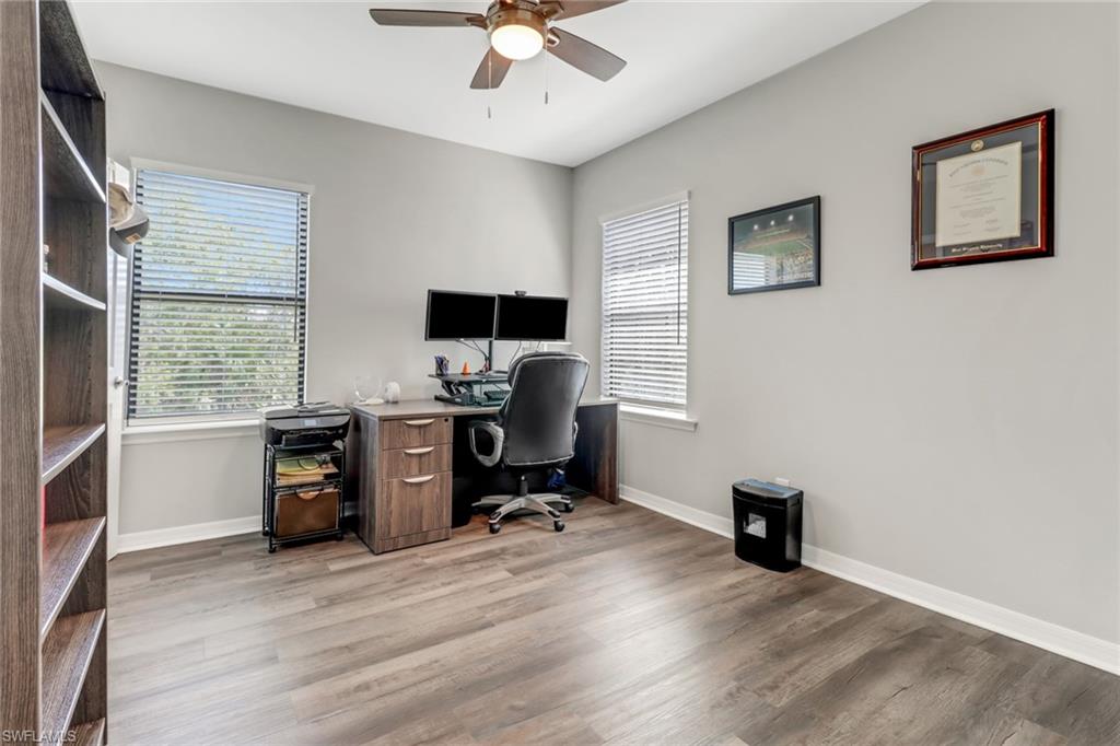 15354 Summit Pl Circle, Unit 159 Naples, FL 34119 - Photo 20 of 27 a view of a workspace with furniture and a window