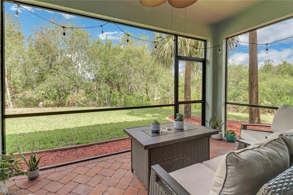 15354 Summit Pl Circle, Unit 159 Naples, FL 34119 - Photo 26 of 27 a room with pool table and a chairs