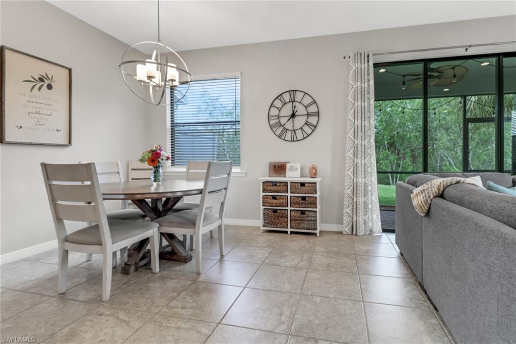 15354 Summit Pl Circle, Unit 159 Naples, FL 34119 - Photo 7 of 27 a view of a dining room with furniture window and outside view