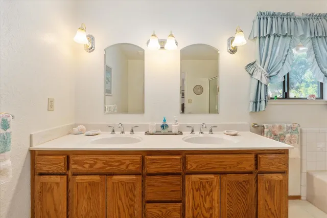 a bathroom with a bathtub and a shower
