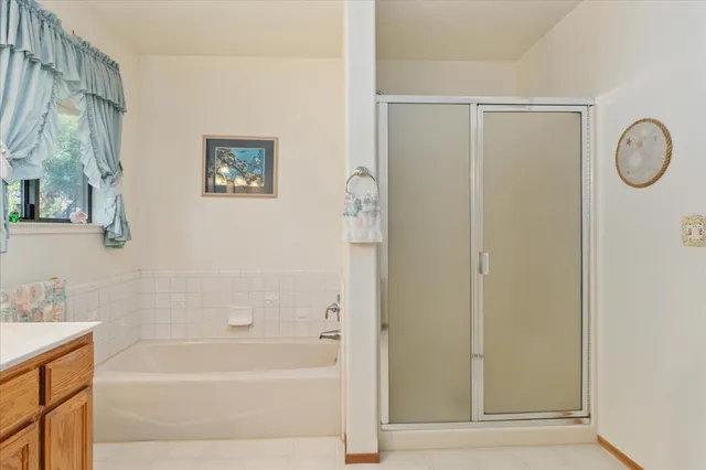 a bedroom with bed and window