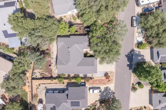 an aerial view of house with yard