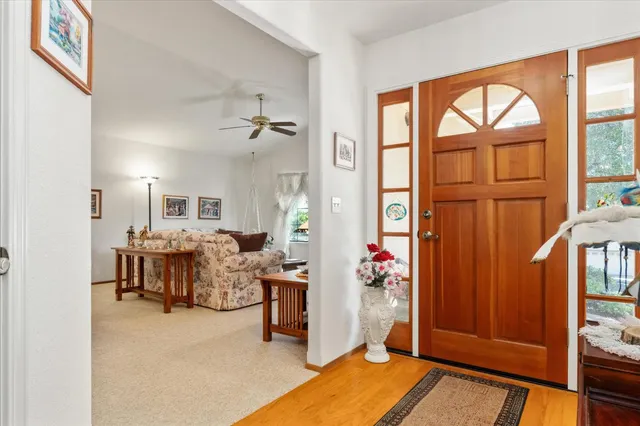 a view of living room kitchen with furniture and large window