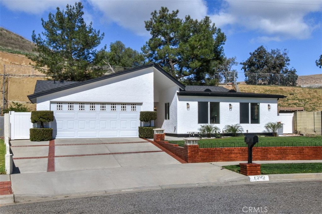 6215 Keystone Street Simi Valley, CA 93063 - Photo 1 of 1 a view of a house with sitting area and garden