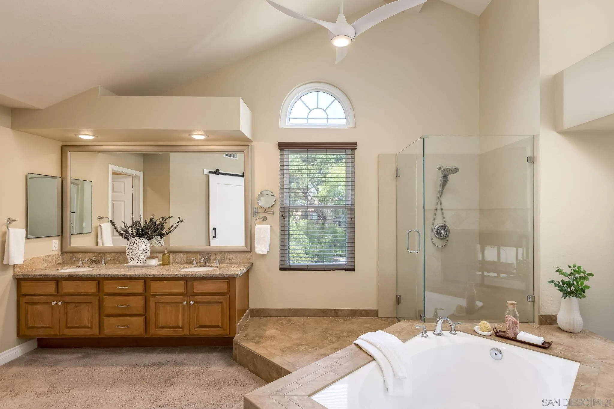 5029 Viewridge Way Oceanside, CA 92056 - Photo 15 of 31 a spacious bathroom with a tub sink and mirror