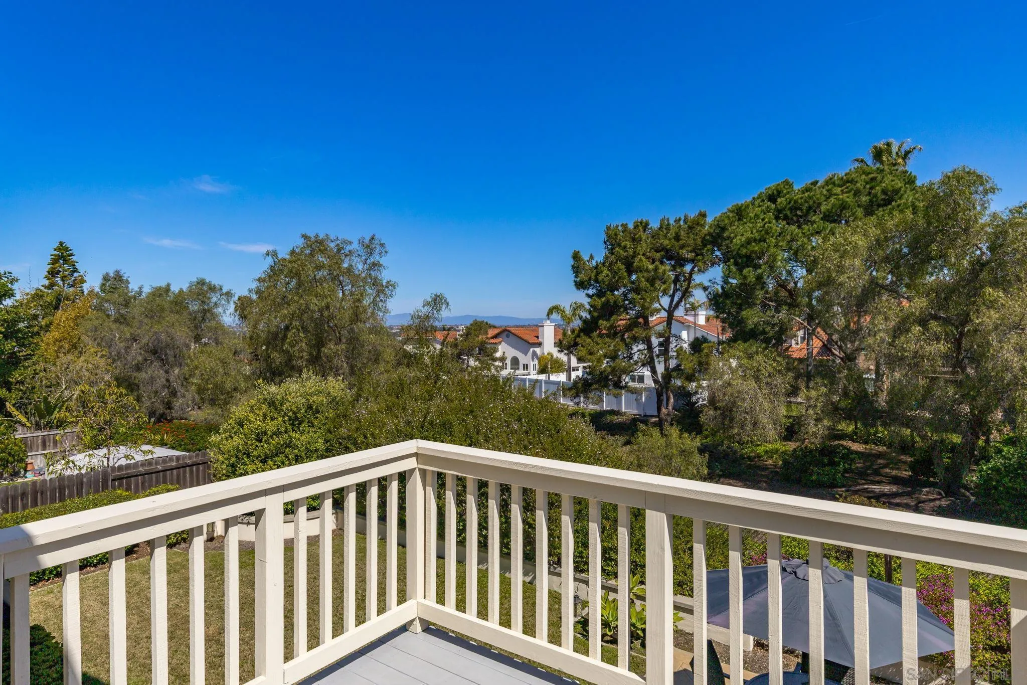 5029 Viewridge Way Oceanside, CA 92056 - Photo 27 of 31 a balcony with trees in the background