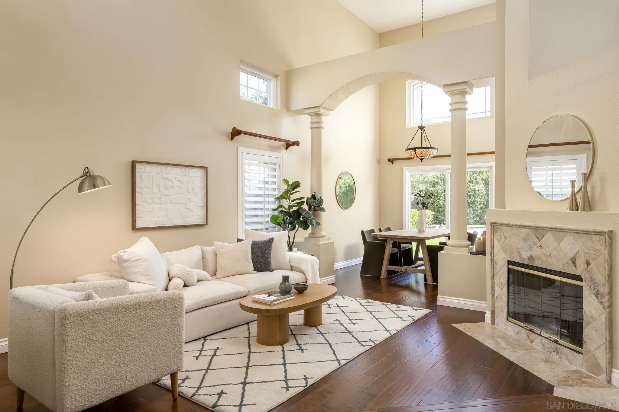 5029 Viewridge Way Oceanside, CA 92056 - Photo 3 of 31 a living room with furniture a fireplace and a table
