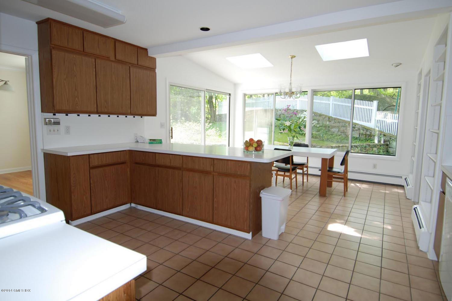 4 Ridgebrook Road Greenwich, CT 06830 - Photo 5 of 10 a kitchen with a sink and cabinets
