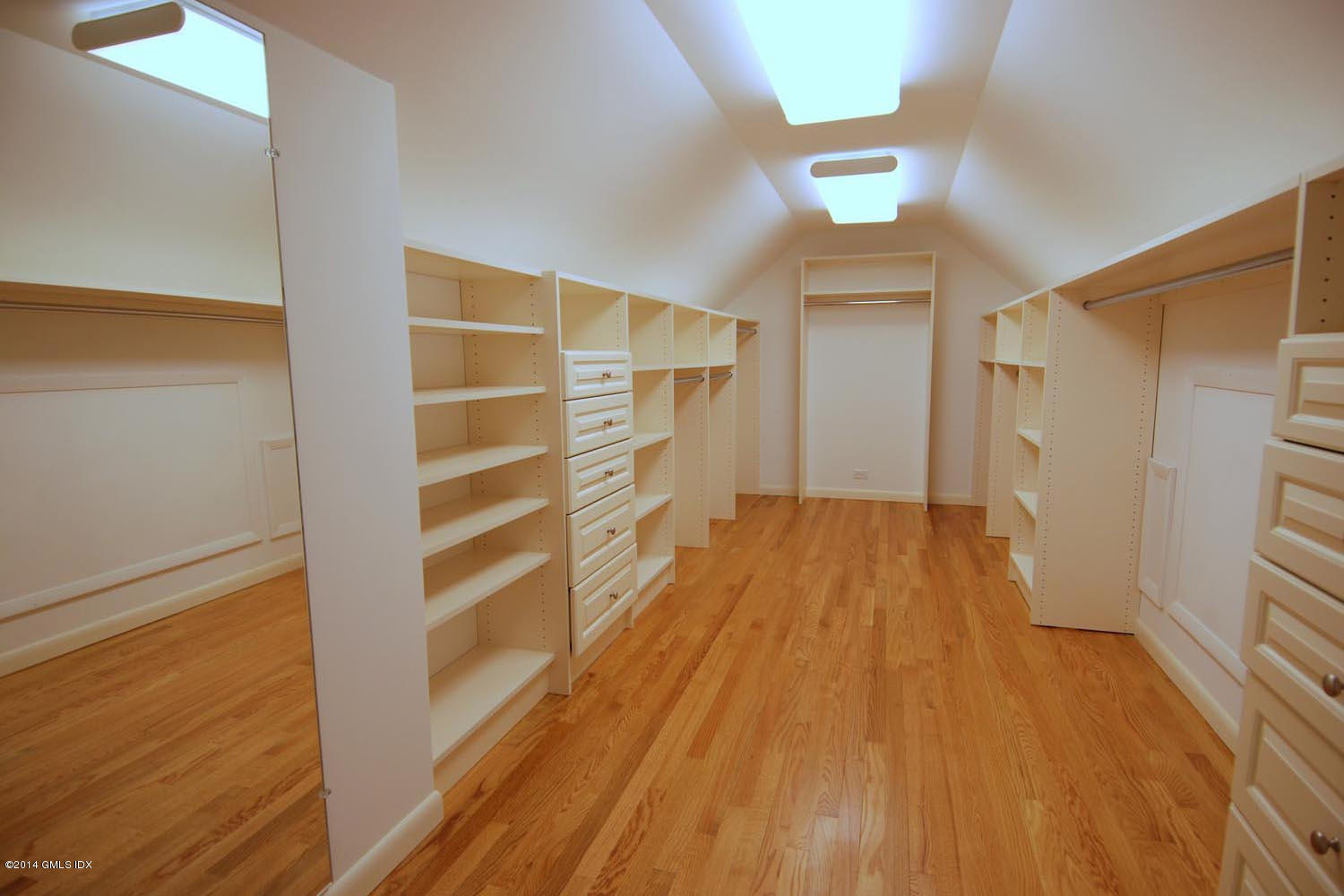 4 Ridgebrook Road Greenwich, CT 06830 - Photo 9 of 10 a view of walk in closet with wooden floor and closet