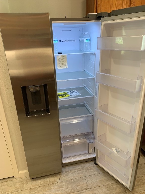17816 Cutback Drive Manor, TX 78653 - Photo 12 of 28 a refrigerator in a kitchen