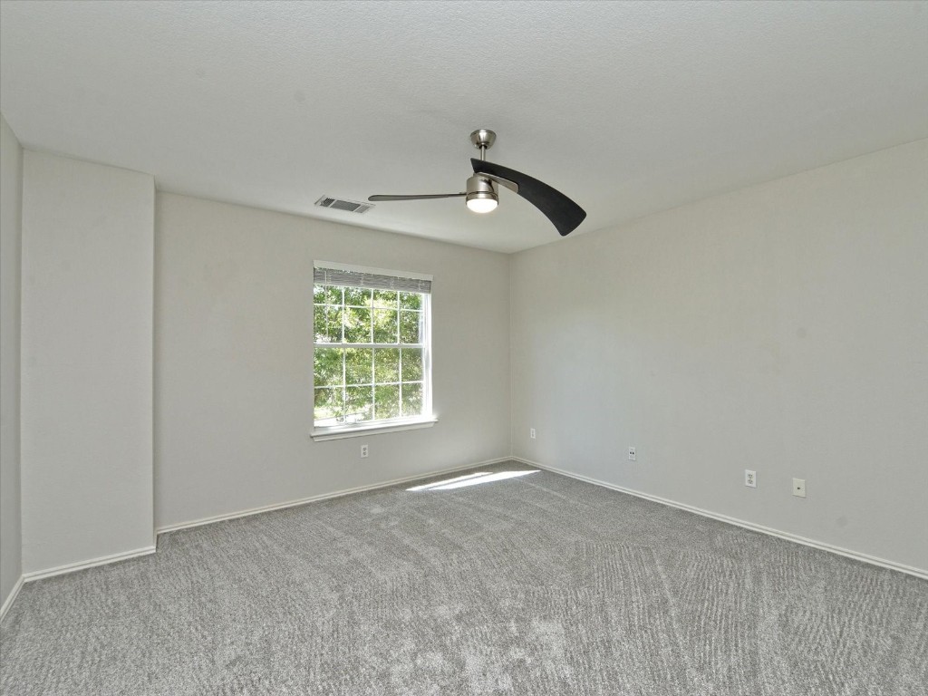 17816 Cutback Drive Manor, TX 78653 - Photo 17 of 28 a view of an empty room with a window