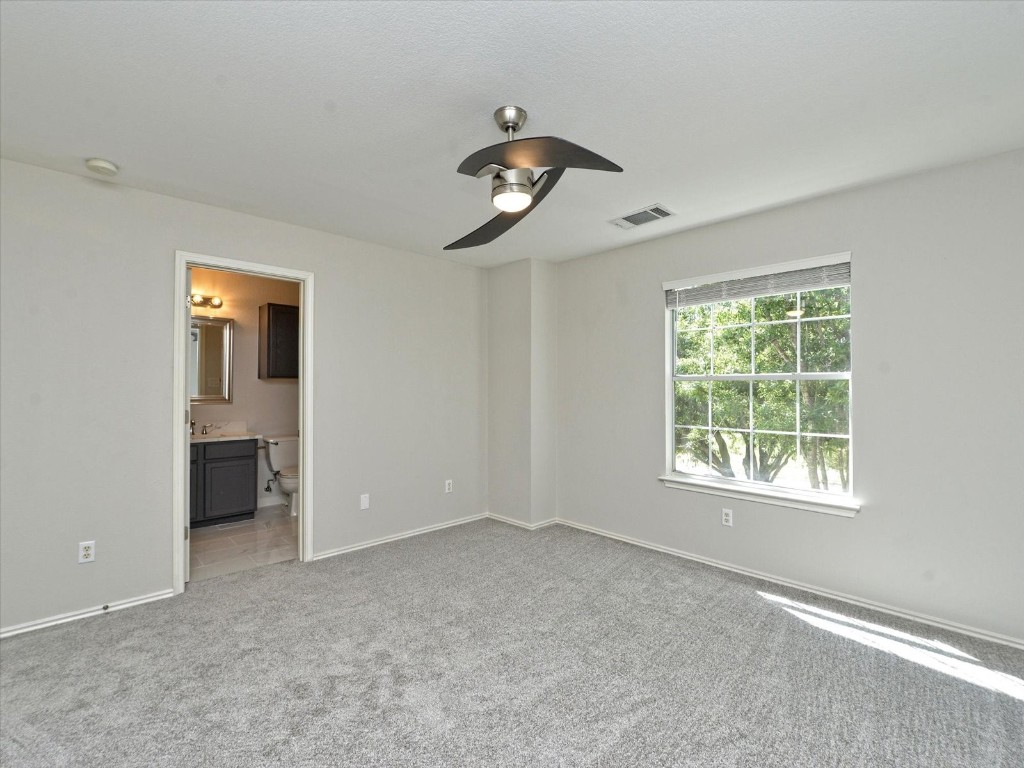 17816 Cutback Drive Manor, TX 78653 - Photo 18 of 28 a view of an empty room with a window