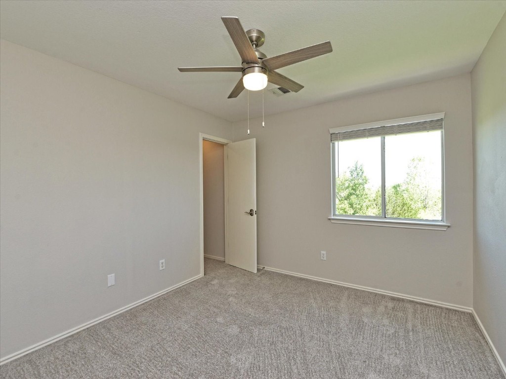 17816 Cutback Drive Manor, TX 78653 - Photo 20 of 28 a view of an empty room with a window