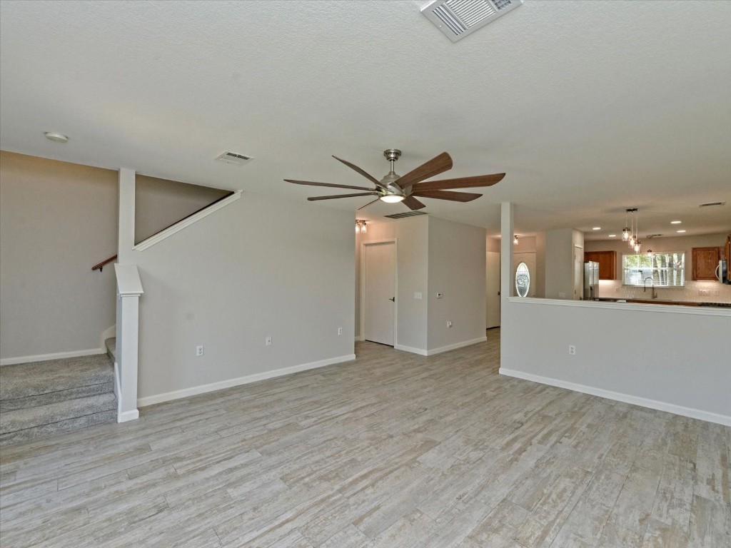 17816 Cutback Drive Manor, TX 78653 - Photo 6 of 28 a view of a livingroom with a ceiling fan