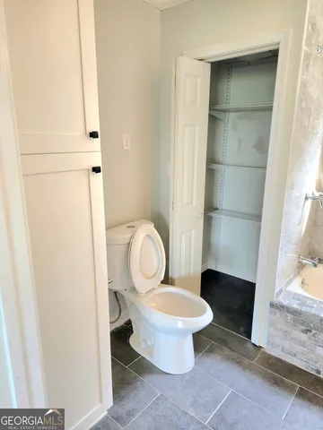 a bathroom with a toilet and a sink