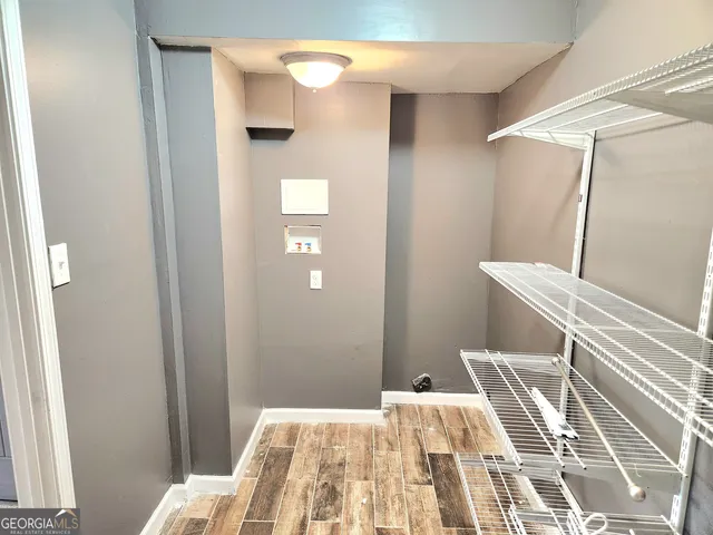 a bedroom with a bed and a rug