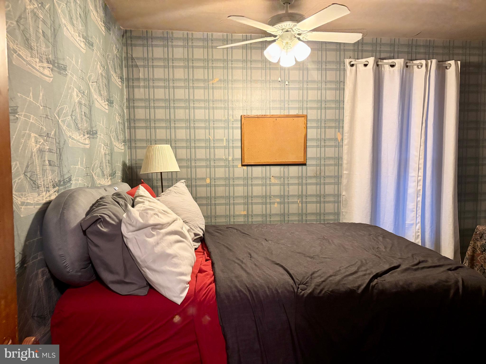 133 Black Street Howard, PA 16841 - Photo 14 of 26 a bedroom with a bed and a painting on the wall