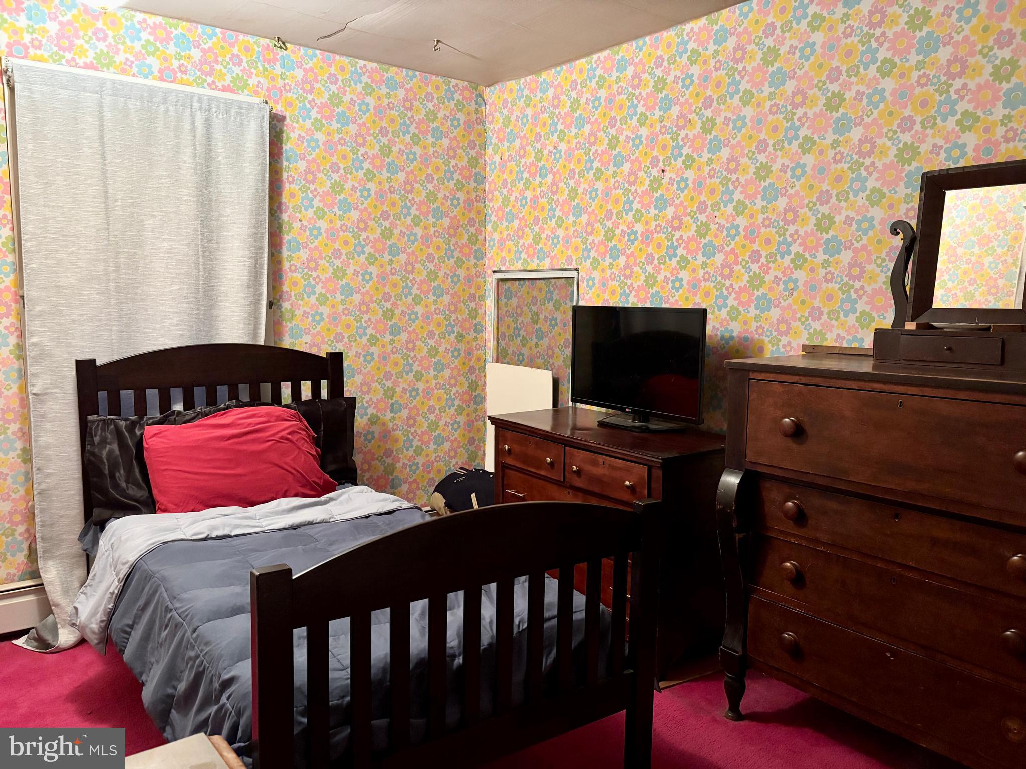 133 Black Street Howard, PA 16841 - Photo 20 of 26 a bedroom with a bed and flat screen tv