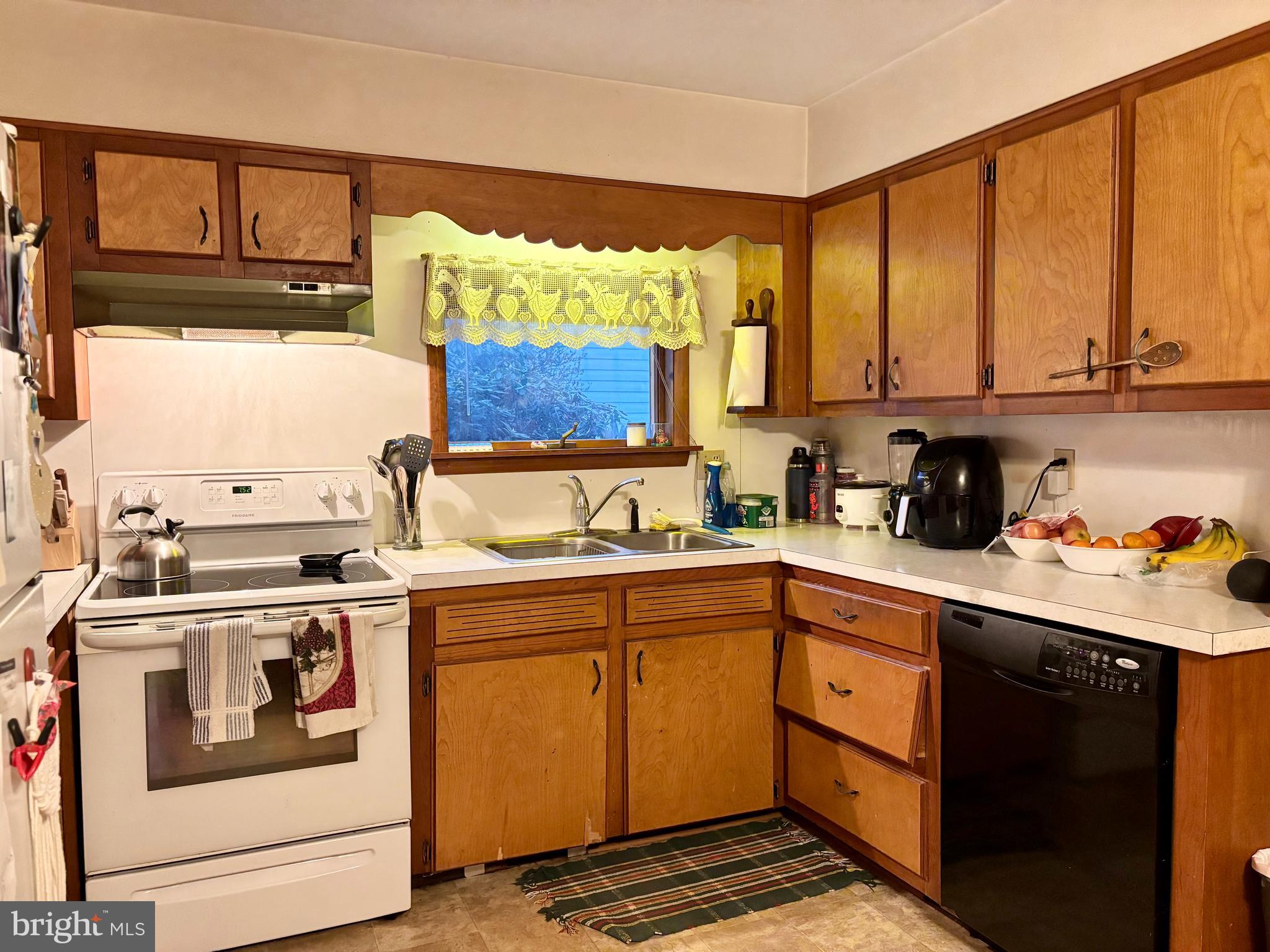 133 Black Street Howard, PA 16841 - Photo 3 of 26 a kitchen with a sink cabinets and window