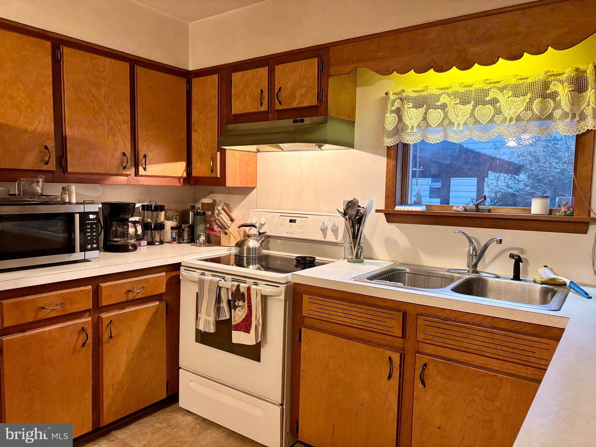133 Black Street Howard, PA 16841 - Photo 4 of 26 a kitchen with a sink stove and cabinets