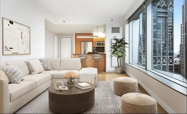 a living room with furniture and a large window