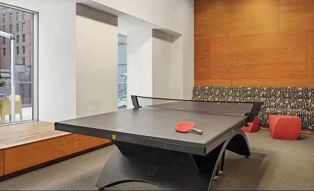 a living room with fireplace furniture and a large window