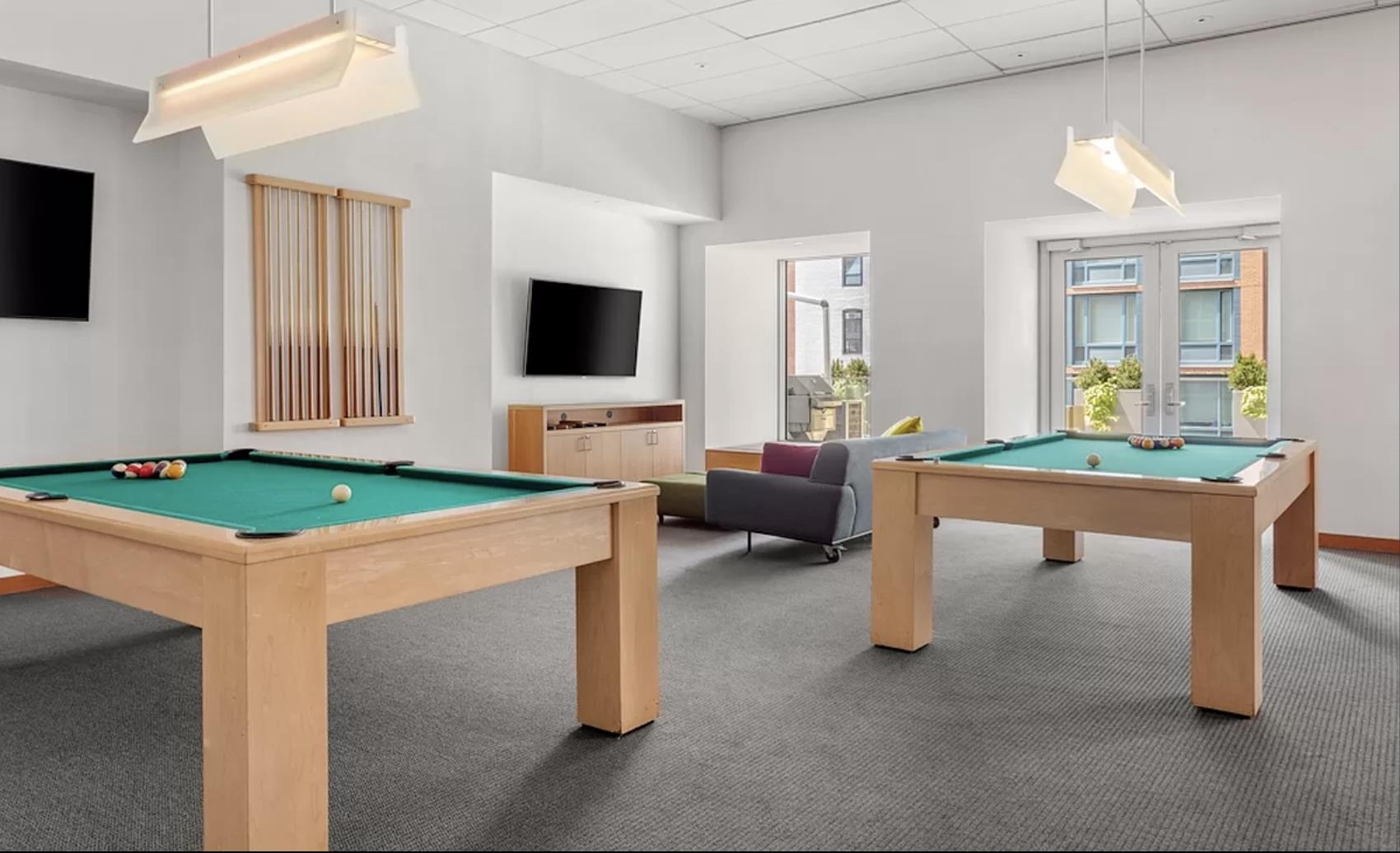 8 Spruce Street, Unit 36T Manhattan, NY 10038 - Photo 10 of 19 a living room with furniture and a flat screen tv