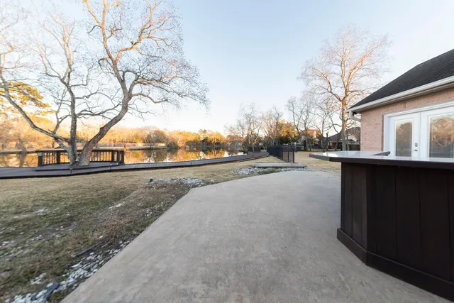 a view of road view with large trees