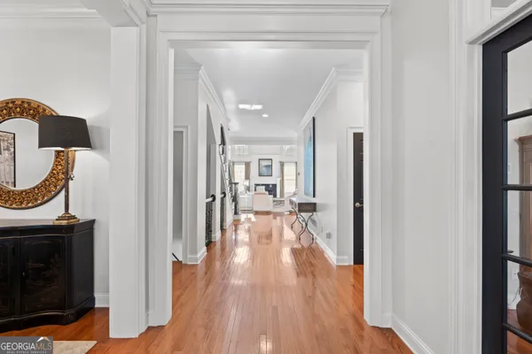 a view of living room with furniture and wooden floor